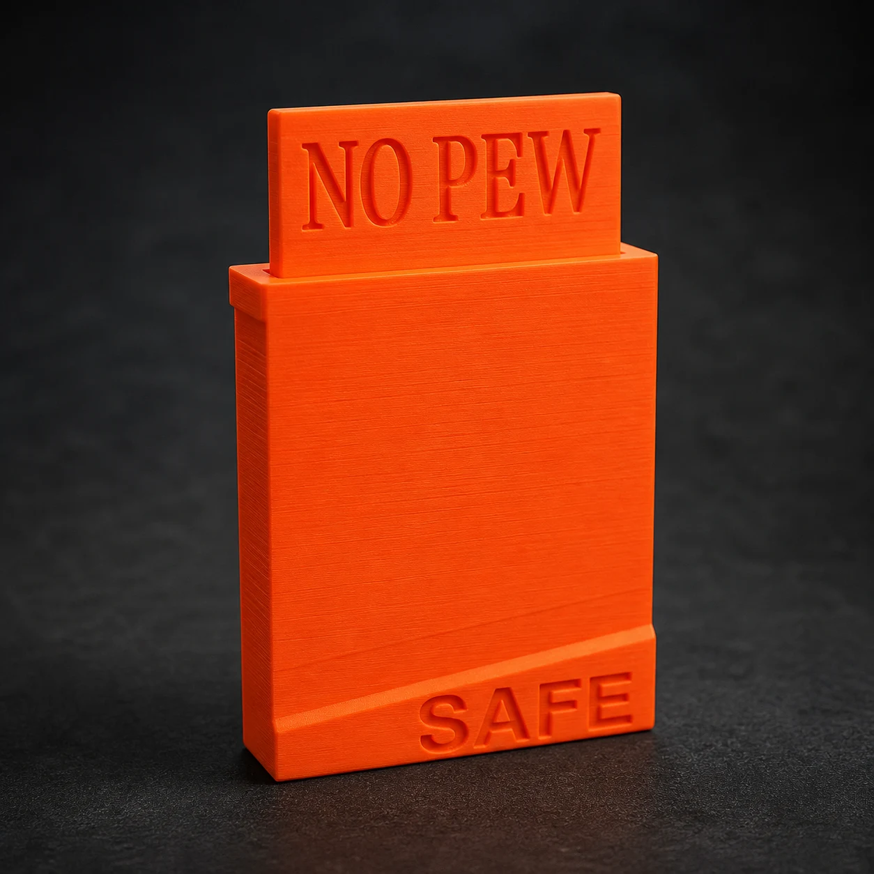 Close-up of an orange AR-15 magazine-well safety flag