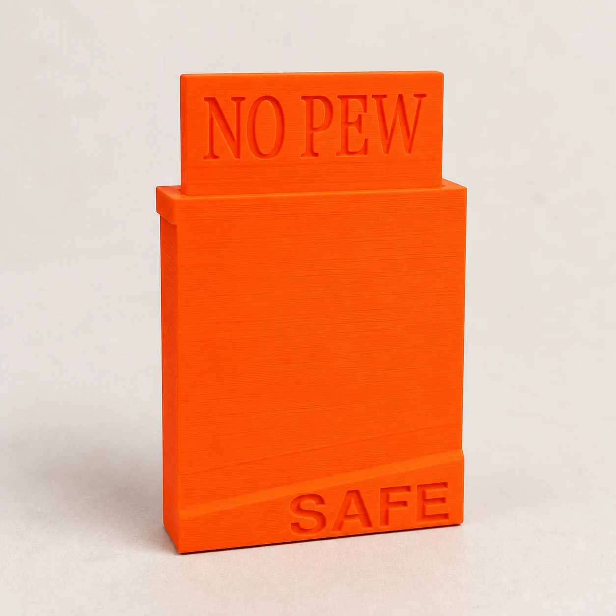 AR-15 safety flag photographed on a neutral studio background
